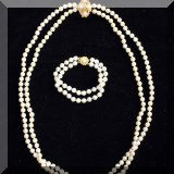 J14. Pearl necklace and bracelet with gold clasps. 